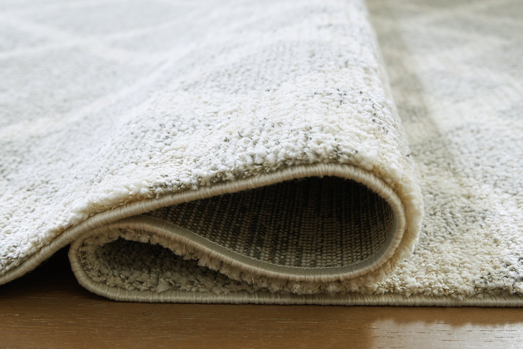 Unawick Large Rug - Bargain Furniture (Detroit, MI)