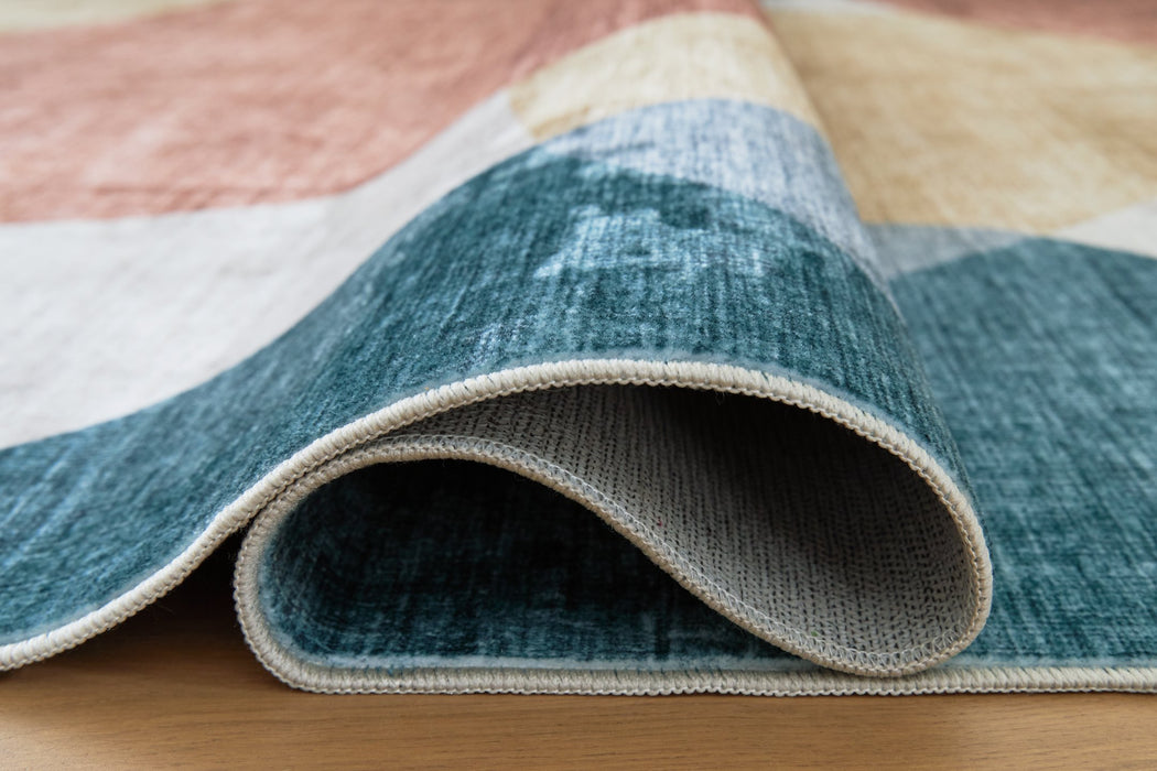 Chanleigh Washable 5' x 7' Area Rug - Bargain Furniture (Detroit, MI)
